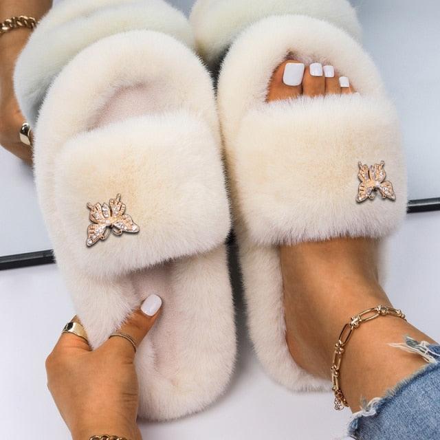 Women's faux fur slippers by Stevvex with rhinestone butterfly accents, cream on Tampa Home & Garden Store