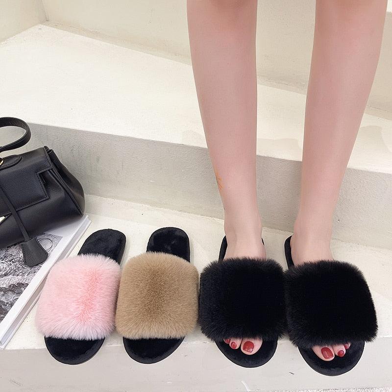 Fluffy slippers women faux fur cross indoor slides four color options on display on Tampa Home & Garden Store