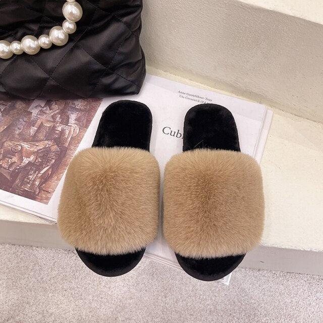 Stevvex fluffy beige faux fur slippers pair with black soles on Tampa Home & Garden Store