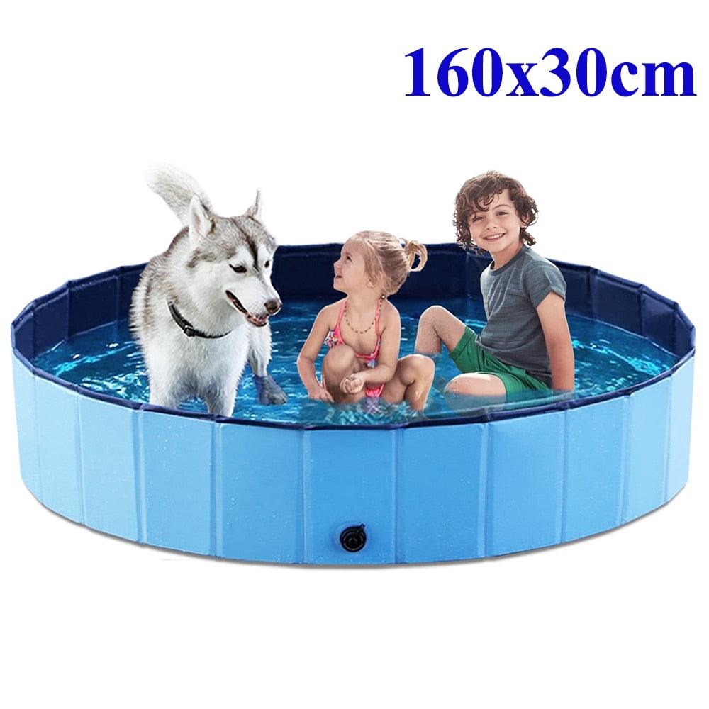 Stevvex foldable blue dog pool 160x30 cm with kids and dog in water on Tampa Home & Garden Store