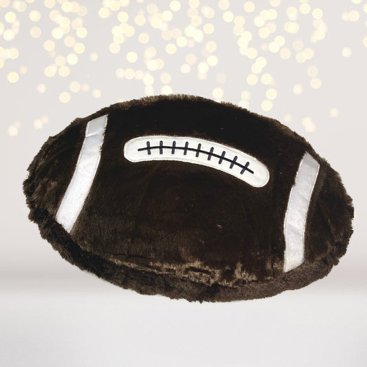 Sports plush throw pillow with dark brown fur and silver straps, features stitched patch on Tampa Home & Garden Store