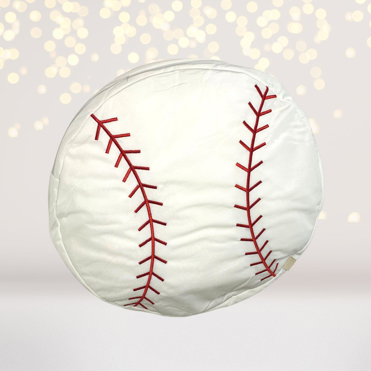 Round white sports plush throw pillow with red baseball-style seam embroidery on Tampa Home & Garden Store