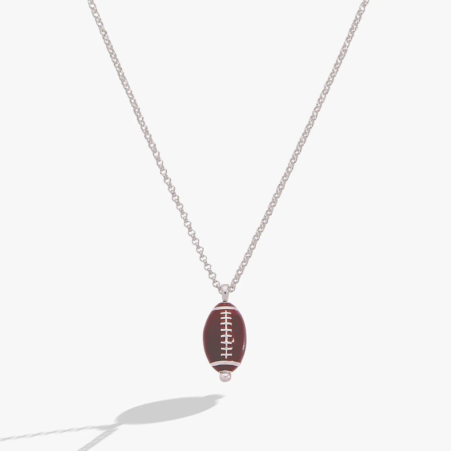 Football Spinner Pendant Necklace with brown football charm and white laces on silver chain on Tampa Home & Garden Store