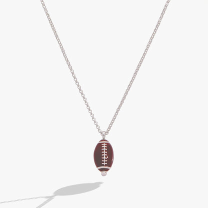 Football Spinner Pendant Necklace with brown football charm and white laces on silver chain on Tampa Home & Garden Store