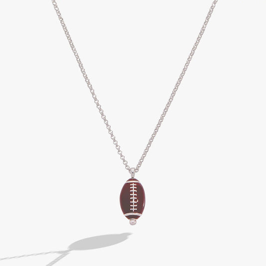 Football Spinner Pendant Necklace with brown football charm and white laces on silver chain on Tampa Home & Garden Store