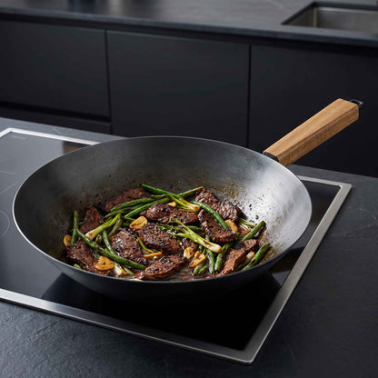 Alva Carbon Steel Wok 12in with wooden handle, beef and green beans stir-fry on Tampa Home & Garden Store