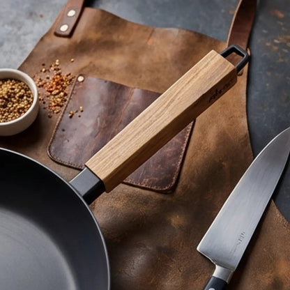 Alva Cookware carbon steel frying pan with wood handle, with knife nearby on leather mat on Tampa Home & Garden Store