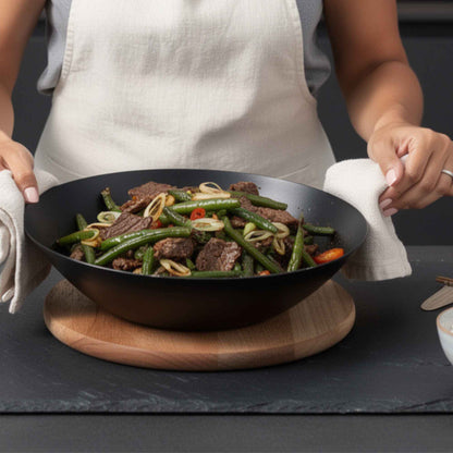 Carbon Steel Wok 12-inch by Alva Cookware, black wok filled with beef and vegetables on Tampa Home & Garden Store