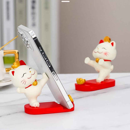 Fortune Cat phone stand by Shaketea; two white Maneki Neko figures with red accents on red bases on Tampa Home & Garden Store