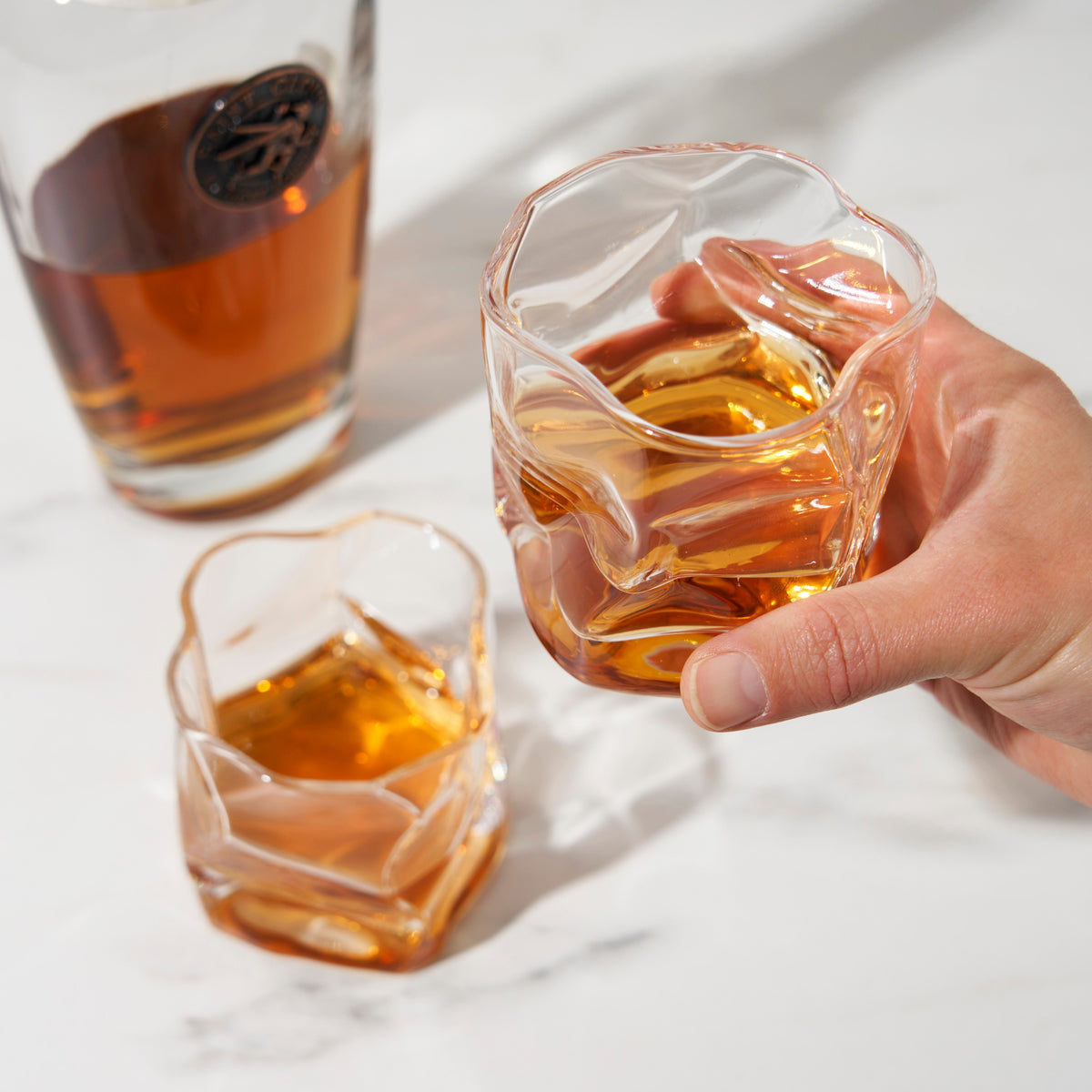 Molten Tumblers Viski stemless cocktail glasses with liquor on Tampa Home & Garden Store