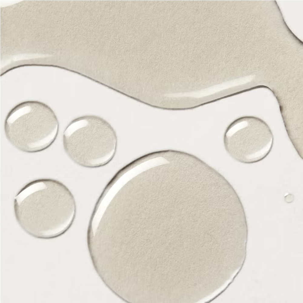 Elemis Frangipani Monoi Body Oil droplets on white surface on Tampa Home & Garden Store