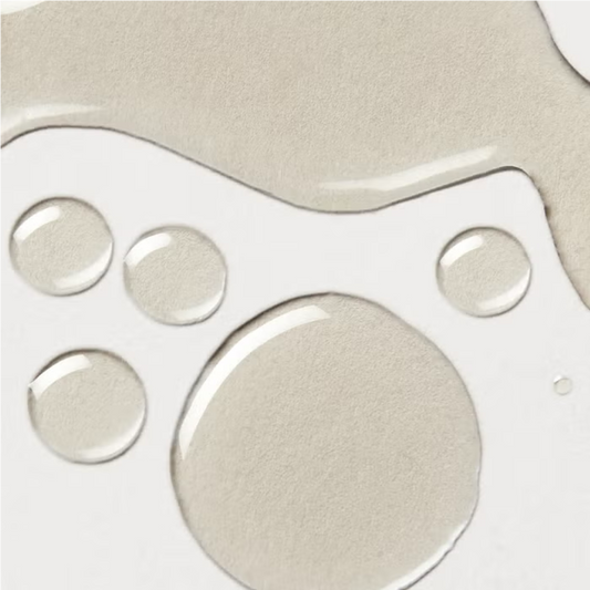 Elemis Frangipani Monoi Body Oil droplets on white surface on Tampa Home & Garden Store