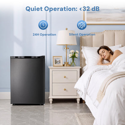 Free Standing Upright Freezer with Shelf in black finish beside a nightstand in a bedroom on Tampa Home & Garden Store