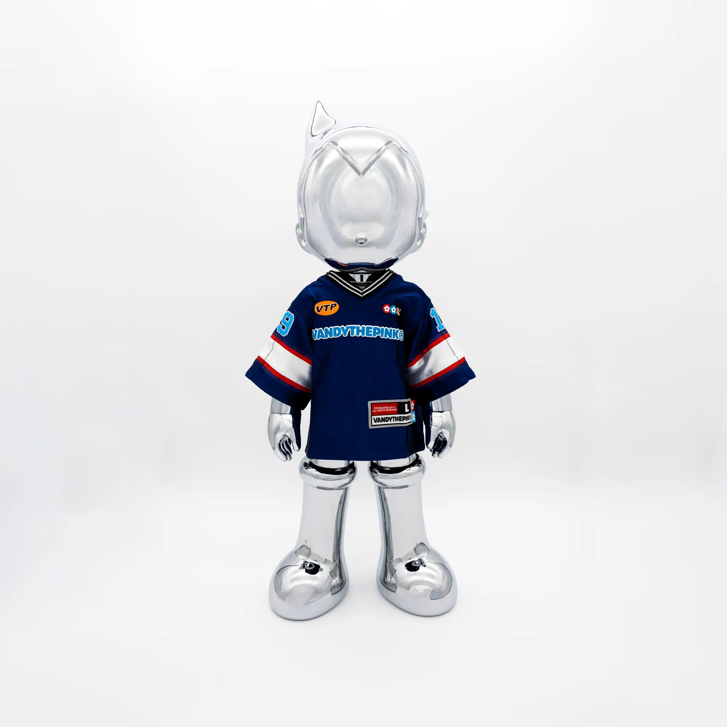 Astro Boy Reimagined action figure with silver cat-ear helmet and blue VANDYTHEPINK jersey on Tampa Home & Garden Store