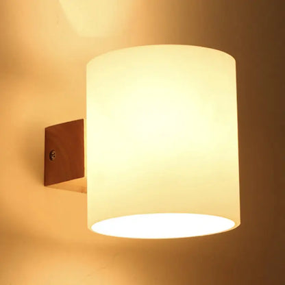 Glass Copper Wall Lamp Decorbites with cylindrical frosted shade and warm glow on Tampa Home & Garden Store