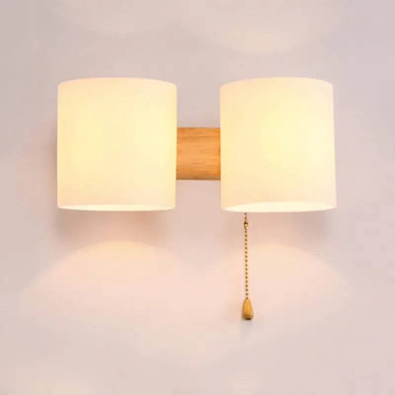 Glass Copper Wall Lamp with dual white fabric shades on a wooden backplate and pull-chain switch on Tampa Home & Garden Store