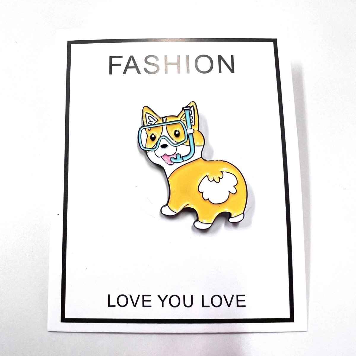 Fun Corgi Enamel Pin Diving Goggles by Shaketea, yellow corgi with blue snorkel on card on Tampa Home & Garden Store