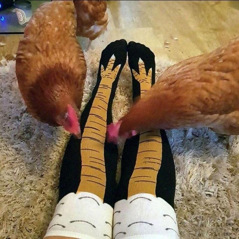 Pair of funny chicken-leg knee socks in tan cotton with black toe accents, cartoon unisex over-the-knee design on Tampa Home & Garden Store