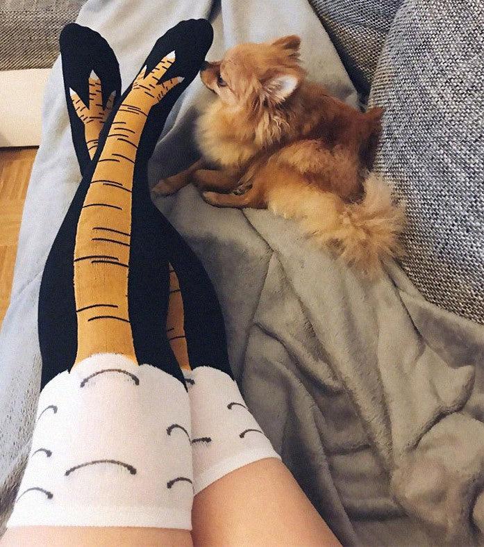 Funny chicken leg knee socks in black with orange-yellow legs and white cuff clouds, unisex on Tampa Home & Garden Store