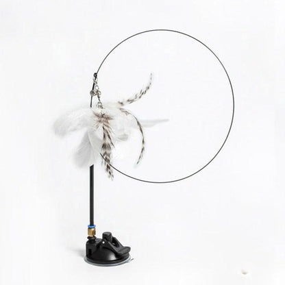 Cat teaser wand by Stevvex with feathers and bell, circular hoop on black stand for kitten play on Tampa Home & Garden Store