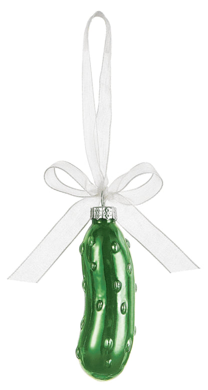 Décoration de Noël en forme de cornichon dans une boîte cadeau à fenêtre
