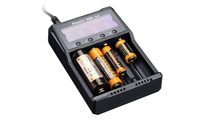 Fenix ARE-A4 battery charger with four slots and LCD display, black chassis, orange AA cells on Tampa Home & Garden Store