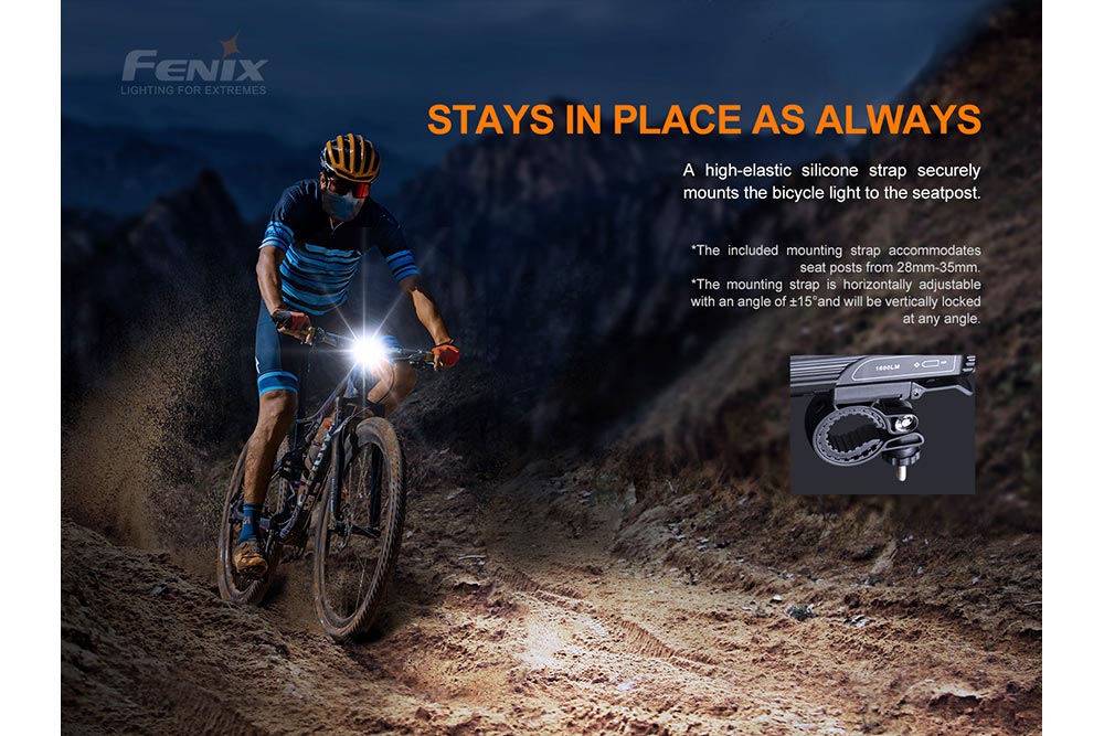 Fenix BC26R LED bike light on handlebars with black body and bright front beam on dirt trail on Tampa Home & Garden Store