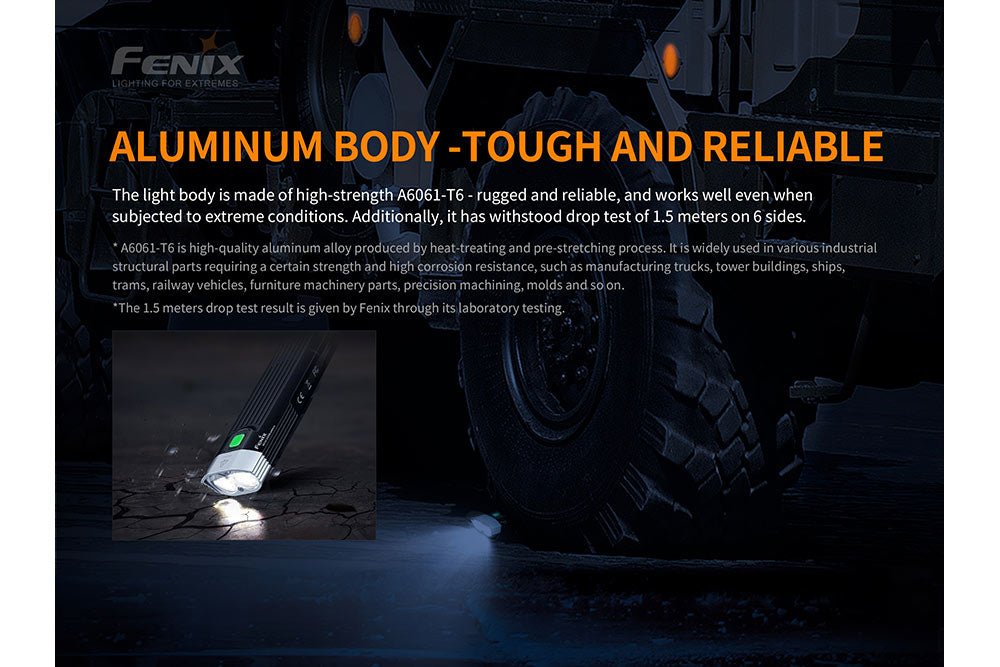 Fenix BC30 V2 LED Bike Light, black aluminum body and green button, beside tire backdrop on Tampa Home & Garden Store