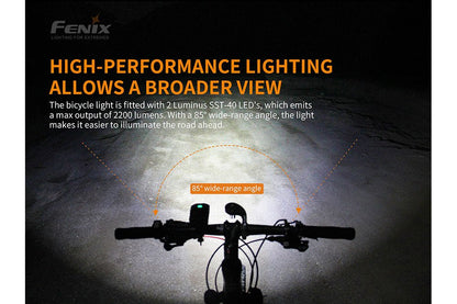 Fenix BC30 V2 LED bike light on handlebars, black silhouette at night with 85° wide-angle beam on Tampa Home & Garden Store
