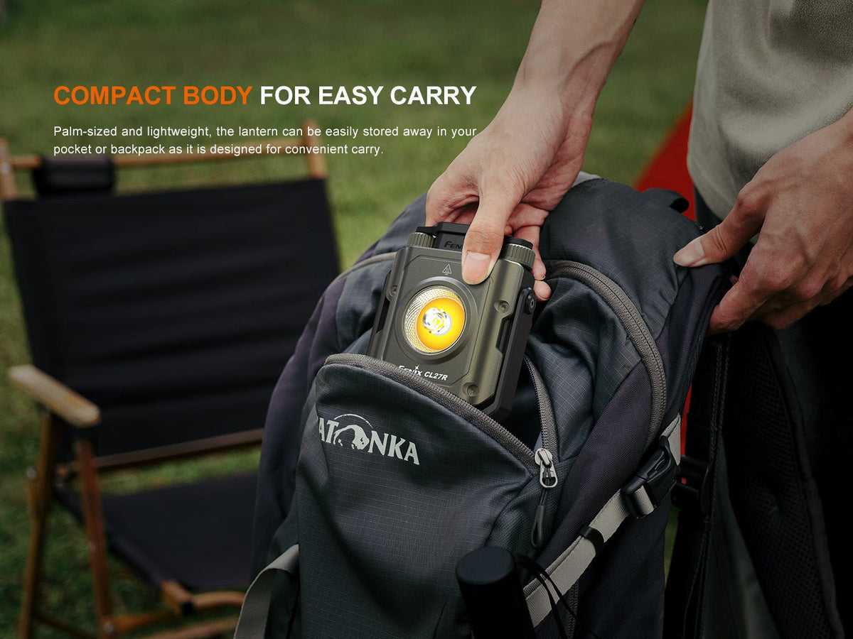 Fenix CL27R lantern camping light in olive-gray being stored in a backpack pocket on Tampa Home & Garden Store