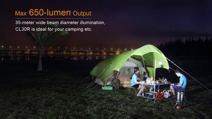 Fenix CL30R LED camping lantern lighting a campsite with a green tent and a group at table on Tampa Home & Garden Store