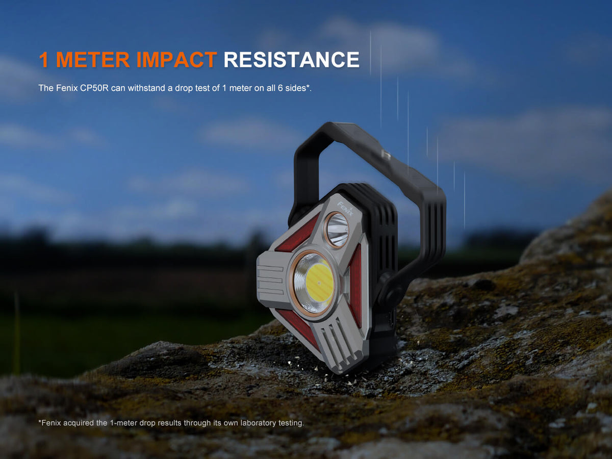 Fenix CP50R lantern with black handle and gray-red body on terrain, Fenix Store, on Tampa Home & Garden Store