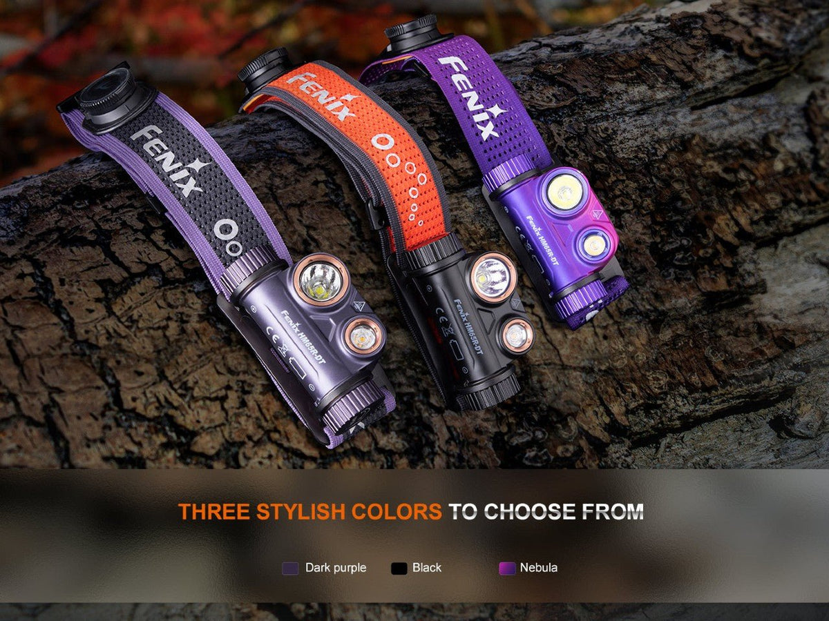 Fenix HM65R-DT headlamp set with three purple, orange and nebula purple straps on a log on Tampa Home & Garden Store