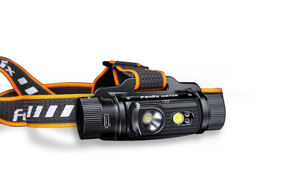 Fenix HM70R rechargeable LED headlamp with black body and orange accents, strap on Tampa Home & Garden Store