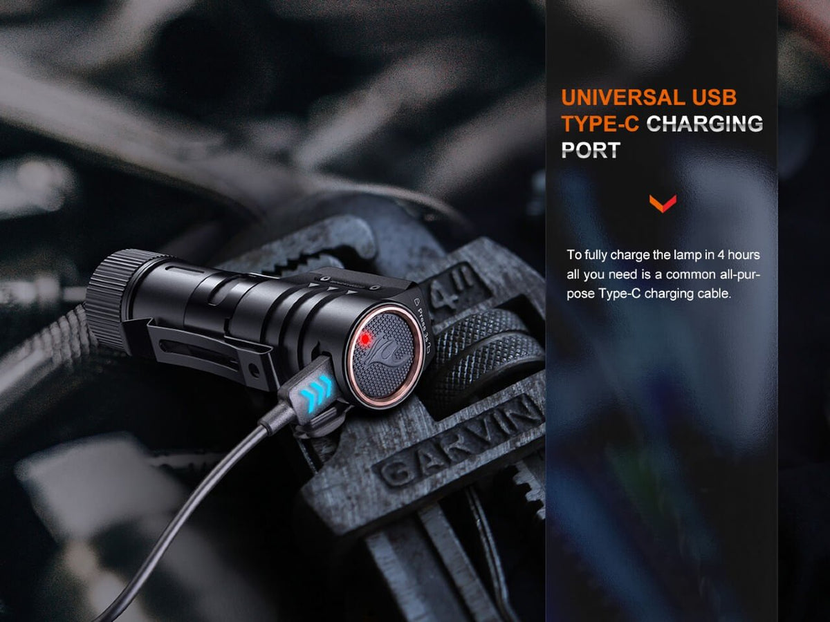 Fenix HM71R headlamp, rechargeable LED, black body with orange ring, USB-C charging cable on Tampa Home & Garden Store