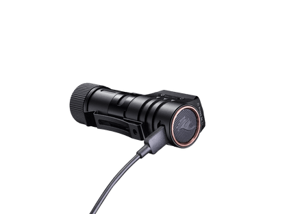 Fenix HM71R headlamp, rechargeable LED, black metal body with copper bezel and charging cable on Tampa Home & Garden Store