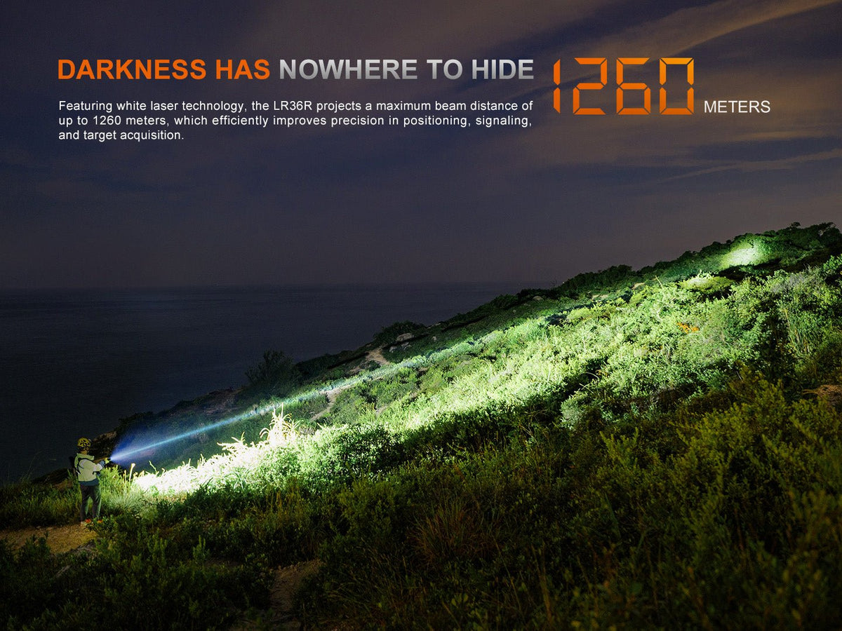 Fenix LR36R white laser searching flashlight shines across hillside at night by Fenix Store on Tampa Home & Garden Store