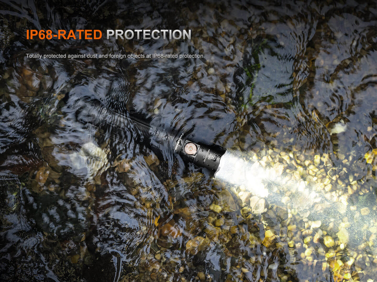 Fenix PD35R ACE EDC handheld flashlight in black, IP68-rated waterproof in rocky stream on Tampa Home & Garden Store