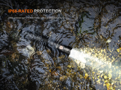 Fenix PD35R ACE EDC handheld flashlight in black, IP68-rated waterproof in rocky stream on Tampa Home & Garden Store