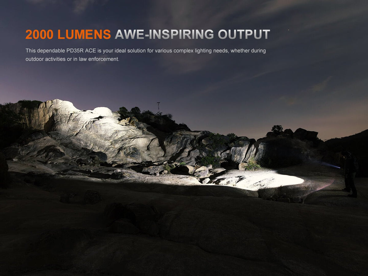 Fenix PD35R ACE EDC handheld flashlight highlighted in a 2000 lumens scene over rocky terrain on Tampa Home & Garden Store