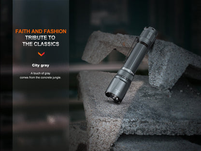 Fenix TK20R UE tactical LED flashlight, 2800 lumens, City gray with textured grip, on concrete on Tampa Home & Garden Store