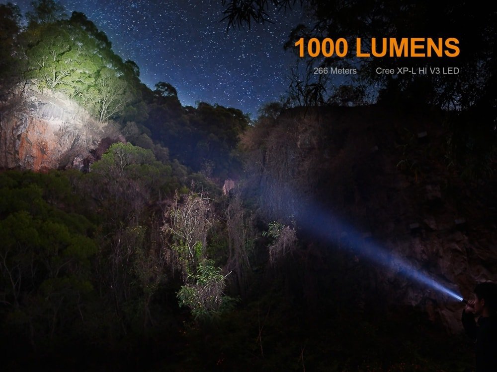 Fenix UC35 V2.0 Rechargeable EDC Flashlight with blue beam across a night canyon 1000 lumens on Tampa Home & Garden Store