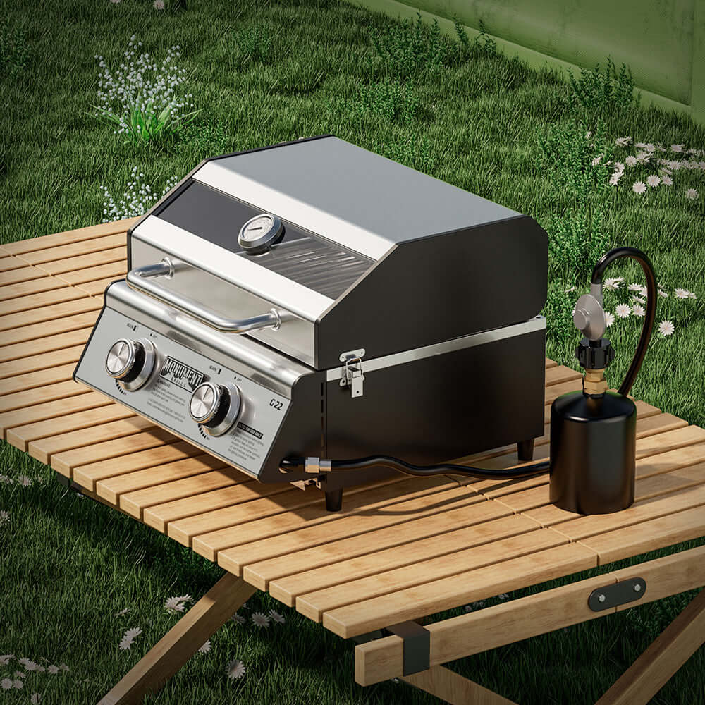G22 stainless tabletop propane grill by Monument Grills with propane tank on outdoor table on Tampa Home & Garden Store