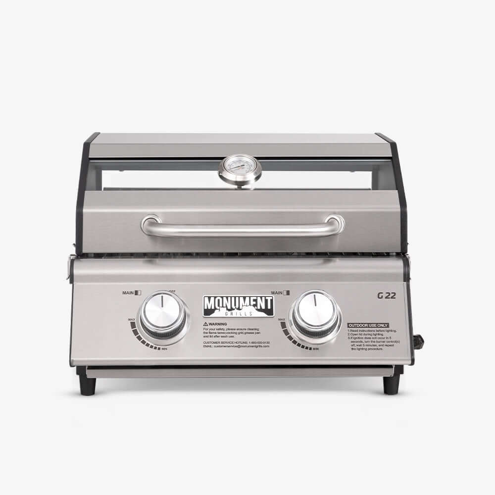 Monument Grills G22 stainless tabletop propane grill with two knobs and lid thermometer on Tampa Home & Garden Store