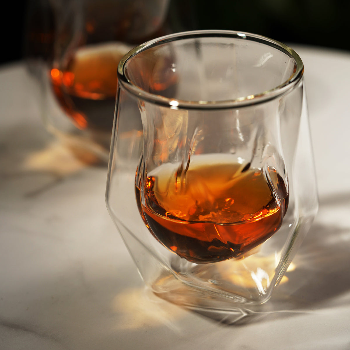 Aerating whiskey taster set of 2 stemless cocktail glasses by Viski with amber liquid on Tampa Home & Garden Store