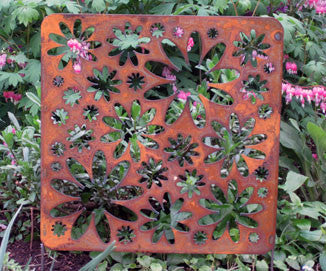 Rust-colored metal panel with flower cutouts; Rustica Ornamentals garden wall art on Tampa Home & Garden Store