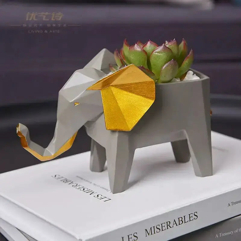 Geometric gray papercraft elephant planter by Decorbites with gold foil ears and succulent on Tampa Home & Garden Store
