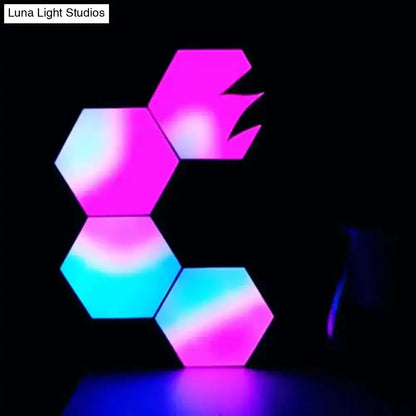 Geometric hexagon LED wall lights with pink purple glow and bluetooth app control on Tampa Home & Garden Store