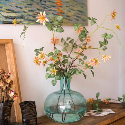 Faux silk German Clematis flower stem orange, 40 inches tall in turquoise glass vase on Tampa Home & Garden Store
