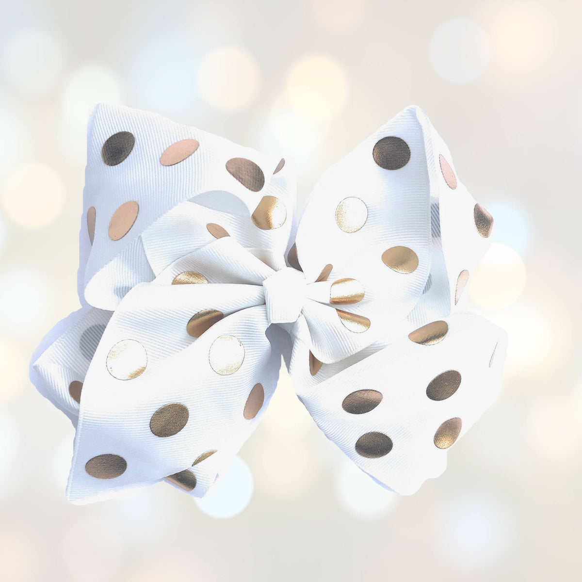 Girls 7 inch white grosgrain hair bow with metallic gold polka dots on alligator clip on Tampa Home & Garden Store